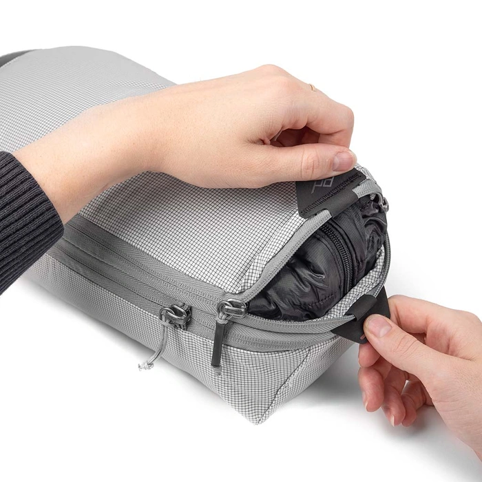 Opening Small Raw Packing cube using the handles